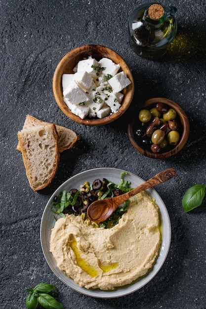 Hummus with olives and herbs