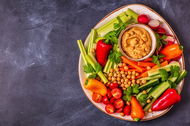 Hummus with various fresh raw vegetables