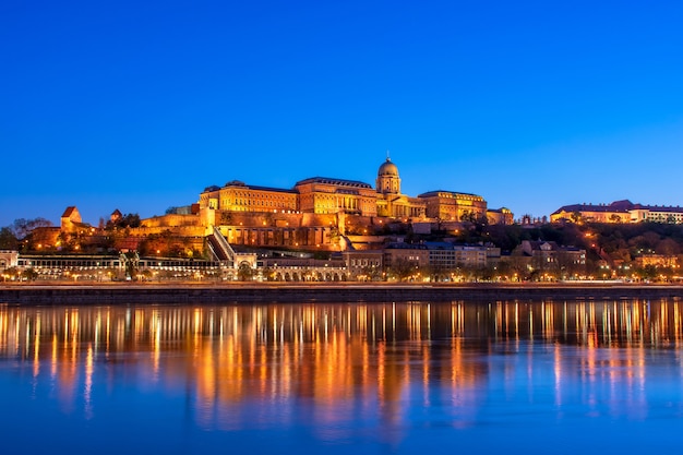 Hungary, Budapest at night, Buda Fortress illuminated by lights, reflected in the water