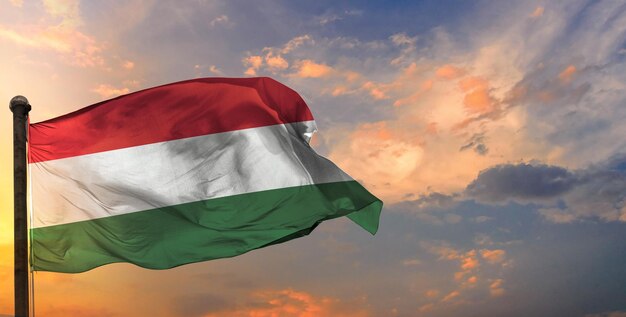 The hungary waving flag and sky background.