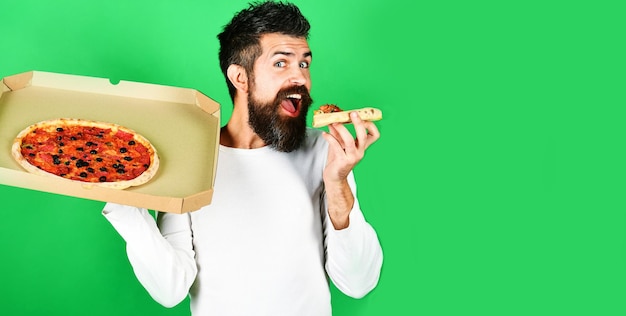 Hungry man eating slice tasty pizza food delivery home man with beard enjoying delicious pizza