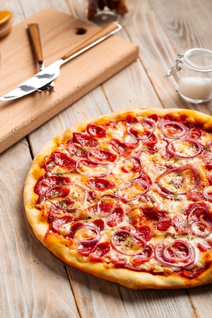 Hunter's sausage pizza on the wooden rustic table