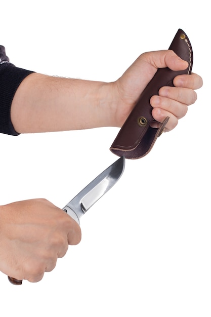 Hunting knife in a hand and sheath isolated