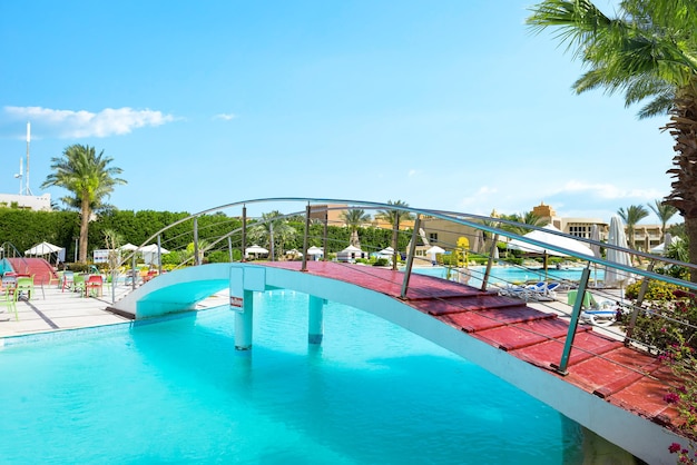 Hurghada, Egypt - March 29, 2019: Bridge over swimming pool in egyptian hotel