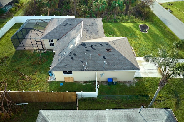 Hurricane Ian destroyed house roof in Florida residential area Natural disaster and its consequences