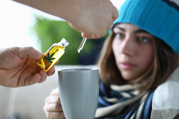 Husband adds marijuana oil extract to sick wife in tea.