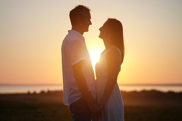 Husband expresses true love to gorgeous lover at back sunset