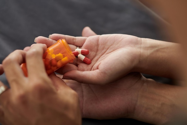 Husband Giving PIlls to Sick Wife