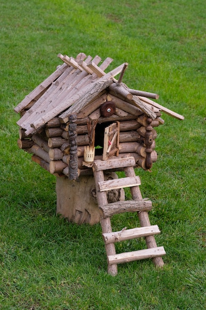 Hut Baba Yaga on green grass