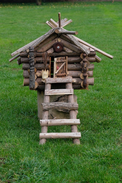 Hut Baba Yaga on green grass