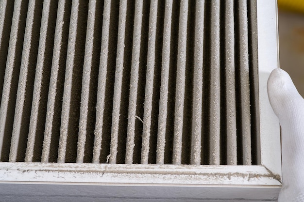 HVAC filter needs to be replaced Dirty old filter with dust