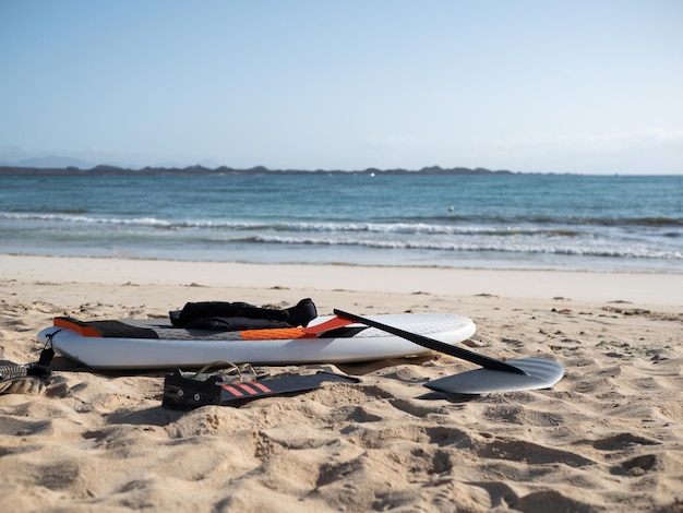 Hydrofoil surfing equipment unmounted on the beach