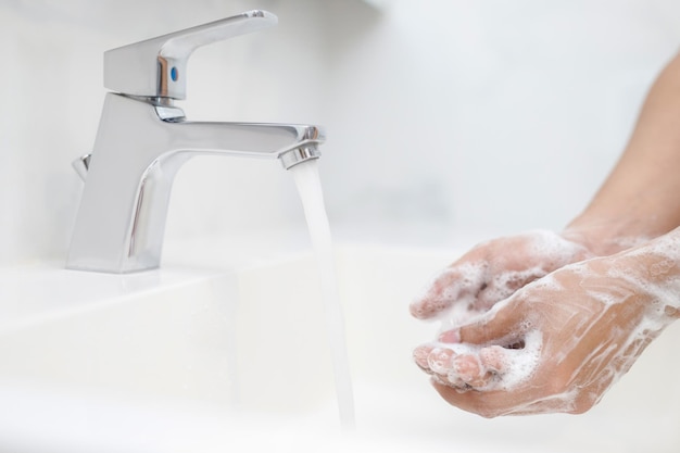 Hygiene Cleaning Hands Washing hands with soap under the faucet with water Pay dirt