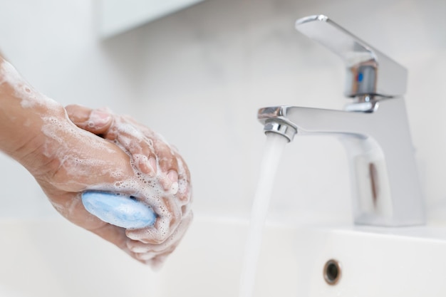 Hygiene Cleaning Hands Washing hands with soap under the faucet with water Pay dirt