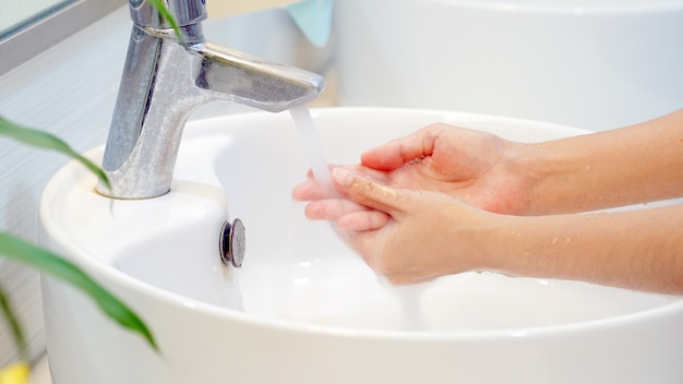 Hygiene concept wash your hands with soap in the sinkcover for virus protection