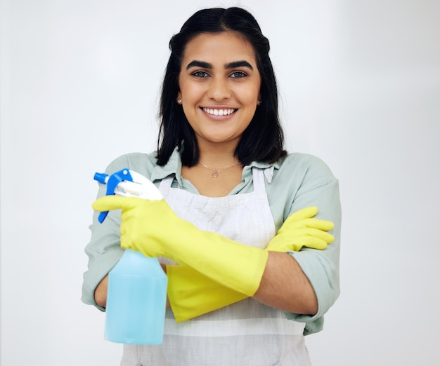 I believe in my choice of cleaning products Shot of a confident young woman standing with her arms crossed while cleaning at home