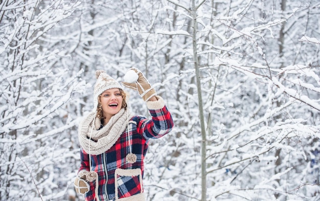 I cant believe in it. snowball holiday on winter day. beautiful woman in warm clothing. Enjoying nature wintertime. Portrait of woman in winter. Cheerful girl outdoors. joyful and energetic woman.