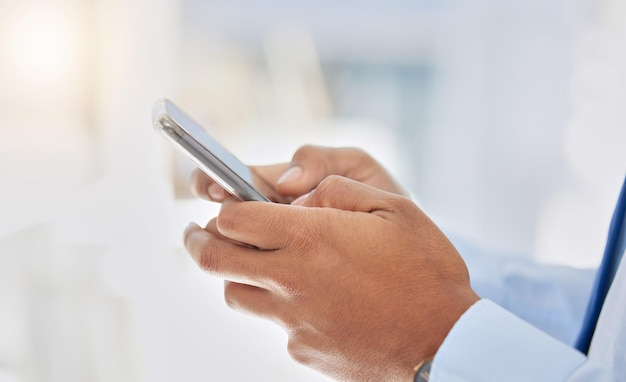 I cant wait to see you. Shot of a businessman using his smartphone to send a text message.