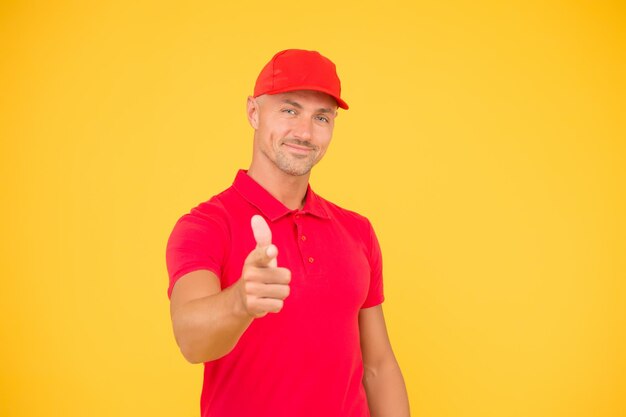 I choose you Happy man pointing finger straight yellow background Pointing index gesture and gesturing Pointing and promoting Marketing and advertising Pointing for capturing attention