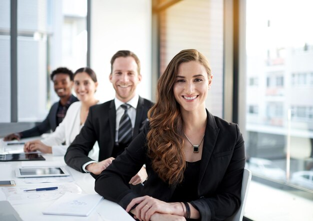 I look forward to achieving success with my team Portrait of a group of business colleagues meeting in the boardroom