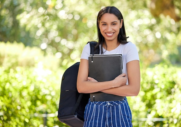 I love education. Cropped portrait of an attractive young female student standing outside on campus.