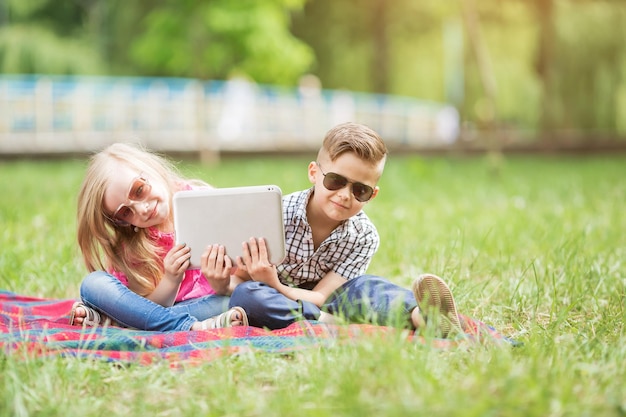 I love my little brother Shot of an adorable brother and sister taking a selfie together while bonding outside