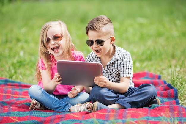 I love my little brother Shot of an adorable brother and sister taking a selfie together while bonding outside