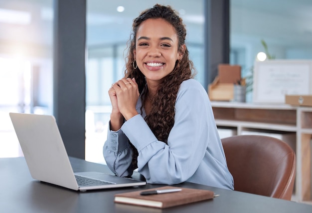 I love what I do Cropped portrait of an attractive young businesswoman working on her laptop while sitting in the office