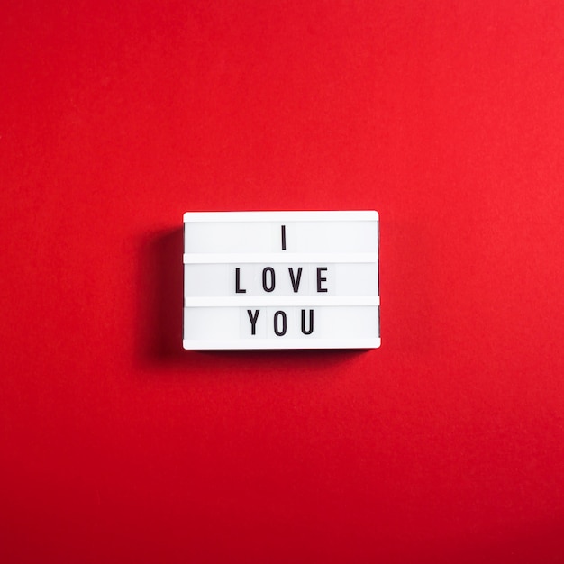 I love you written on a decorative lamp on a bright red background