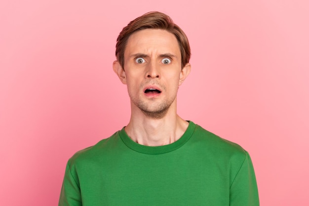 I'm afraid Portrait of scared man isolated on pink studio background Human emotions facial expression