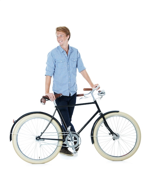 Photo i take things slow a handsome young redheaded man standing next to an oldfashioned bicycle