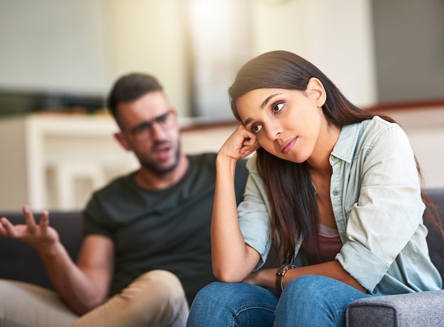 I wish we would stop arguing for once Shot of a young woman looking unhappy after having a fight with her partner at home