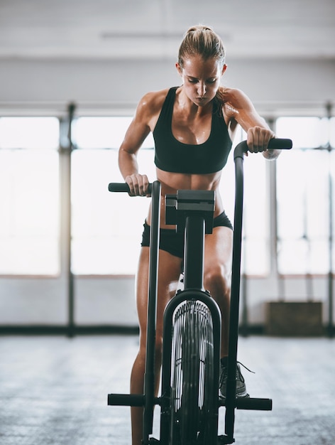 I work for everything I want in life Shot of a woman working out on a elliptical machine