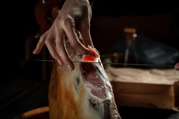 Photo iberian ham cutter traditional spanish ham slicing of drycured hamon is fortyeight weeks old gastronomic products of spain