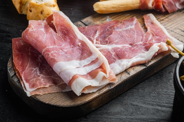 Iberian hamon set, on black wooden table