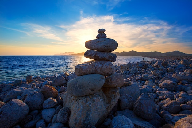 Ibiza Cap des Falco beach sunset with desire stones