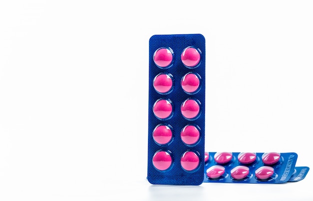 Ibuprofen in pink tablet pills pack in blue blister pack with copy space