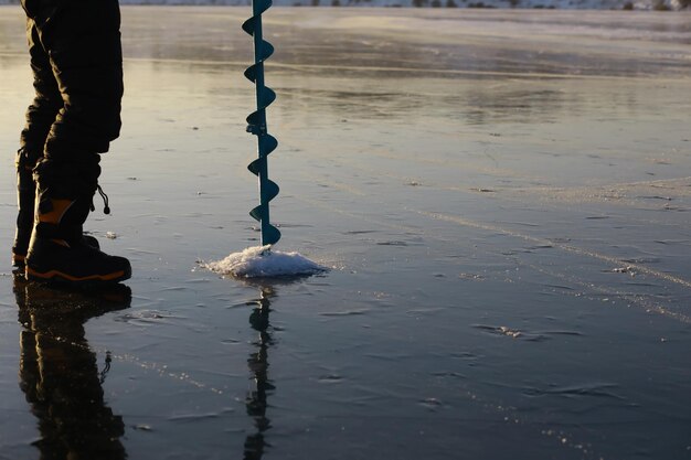 Ice ax ice screws on winter fishing on the ice caves Ice is very clean and beautiful The Lake Baikal