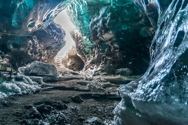 Ice cave located beneath glacier among ice mountain in Iceland it is mesmerizing landmark