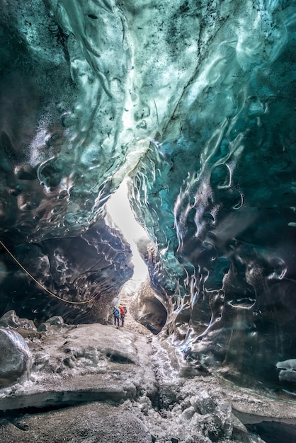 Ice cave located beneath glacier among ice mountain in Iceland it is mesmerizing landmark