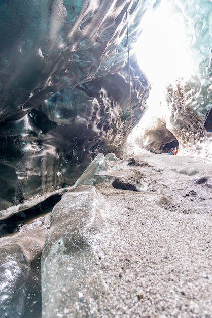 Ice cave located beneath glacier among ice mountain in Iceland it is mesmerizing landmark