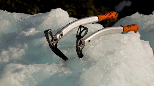 Ice climbing equipment on snow.