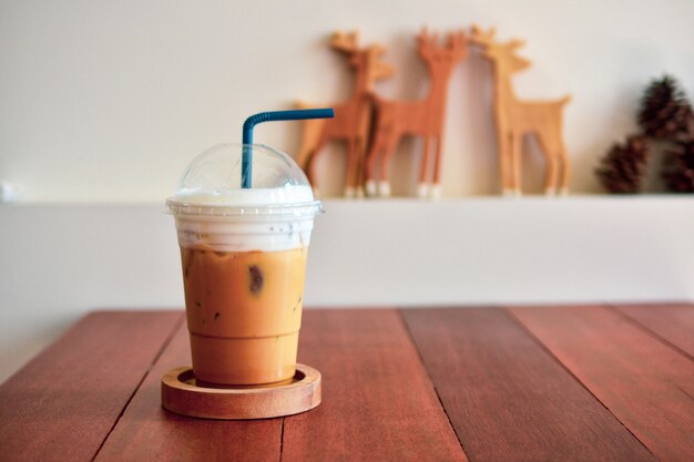 Ice coffee on wooden table at coffee shop Food and Drink