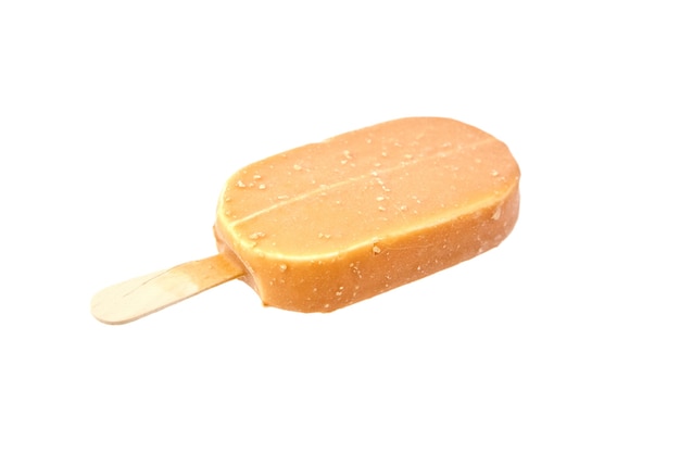 Ice cream in caramel glaze on a wooden stick isolated