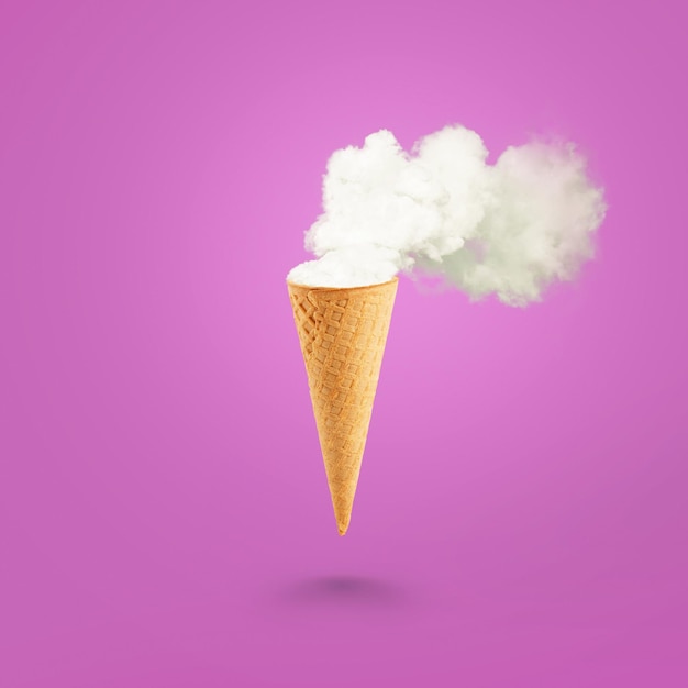 Ice cream cone and white smoke on pastel pink background Flat lay Global warming concept