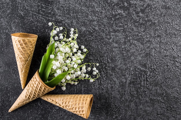 Ice cream cone with snowdrop flower of the valley