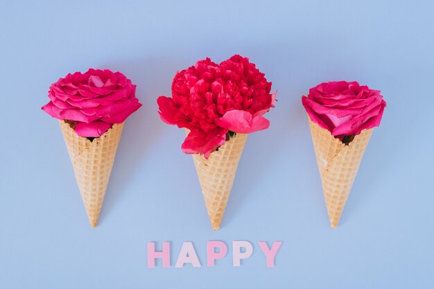 Ice Cream Cones with pink peony and roses. Valentine's day concept