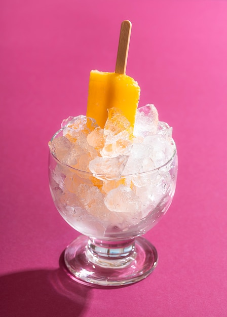 Ice cream popsicle in a bowl of ice