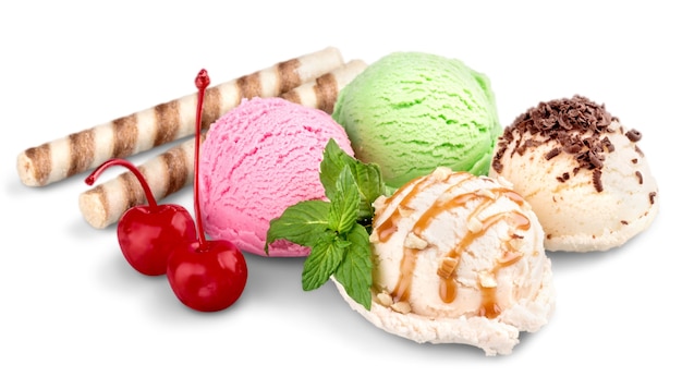 Ice cream scoops with wafers and cherries on white background