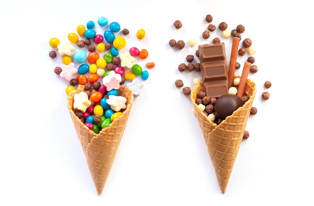 Ice cream waffle cones with candy isolated on white background